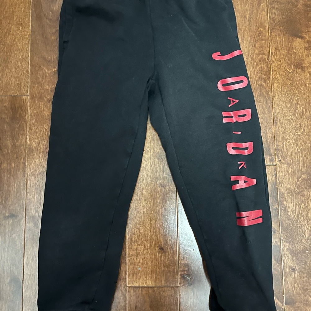 Boys black and red Jordan jogging pants.